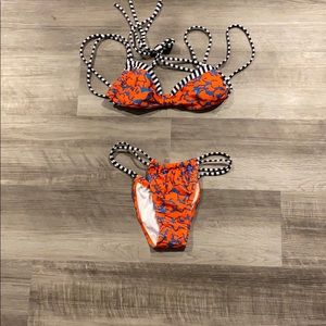 Orange, blue, and black bikini